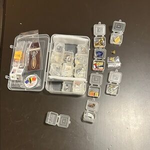 Random mix of tie clips and trinkets